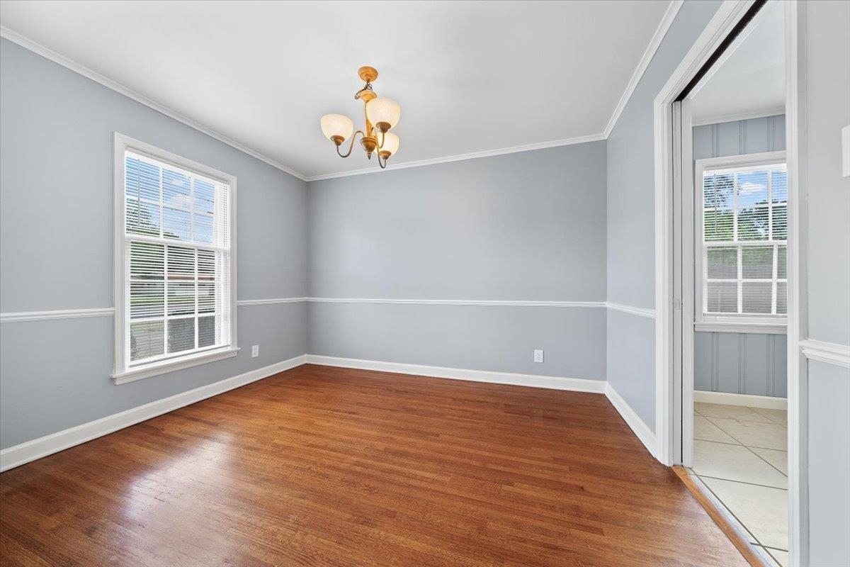 5343 Quince Road Memphis, TN 38119 - Photo 30 of 33 an empty room with wooden floor and windows