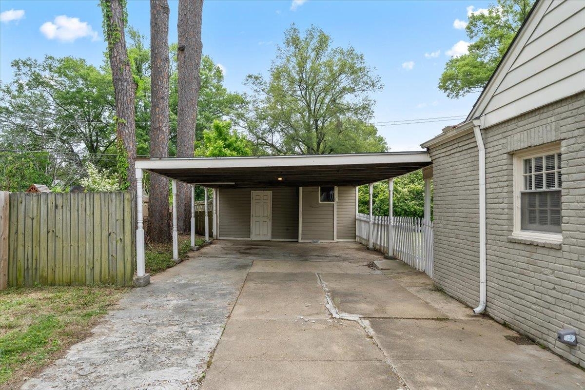 5343 Quince Road Memphis, TN 38119 - Photo 3 of 33 a view of backyard with large trees and plants