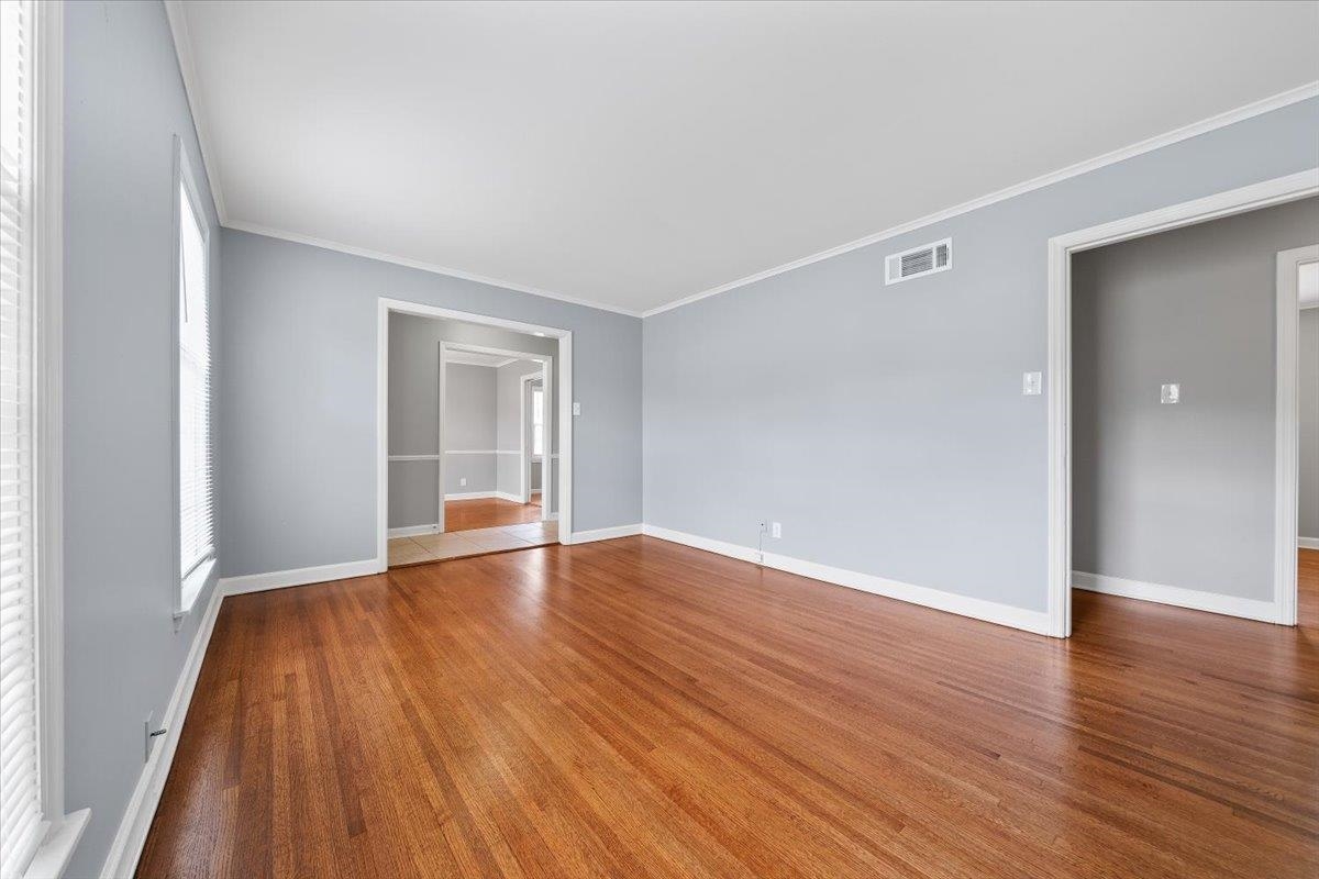 5343 Quince Road Memphis, TN 38119 - Photo 33 of 33 a view of an empty room with wooden floor and a window