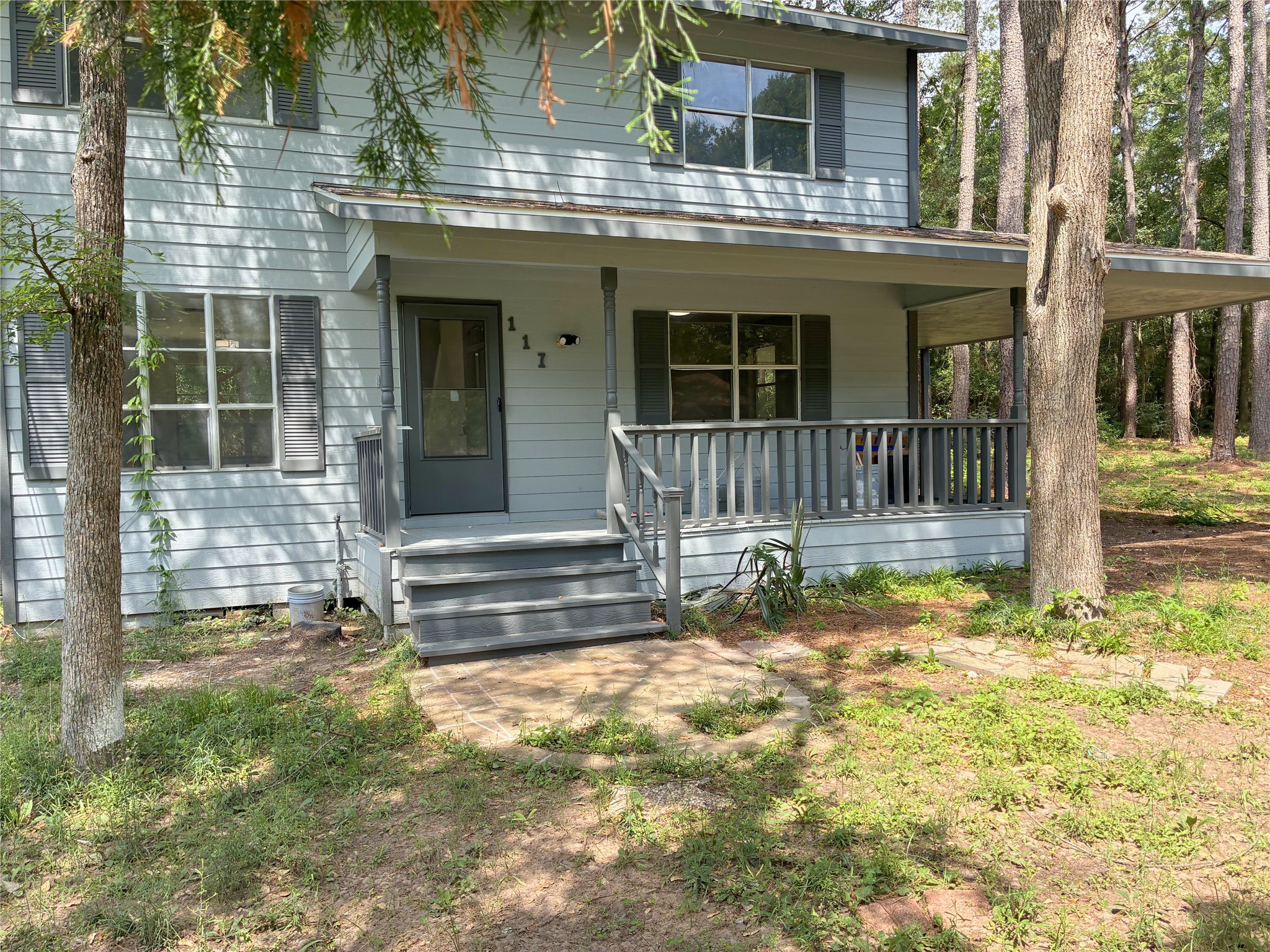117 Amanda Street Conroe, TX 77304 - Photo 3 of 35 a view of house with backyard outdoor seating area