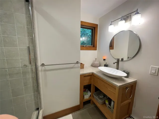 a bathroom with a sink and a mirror