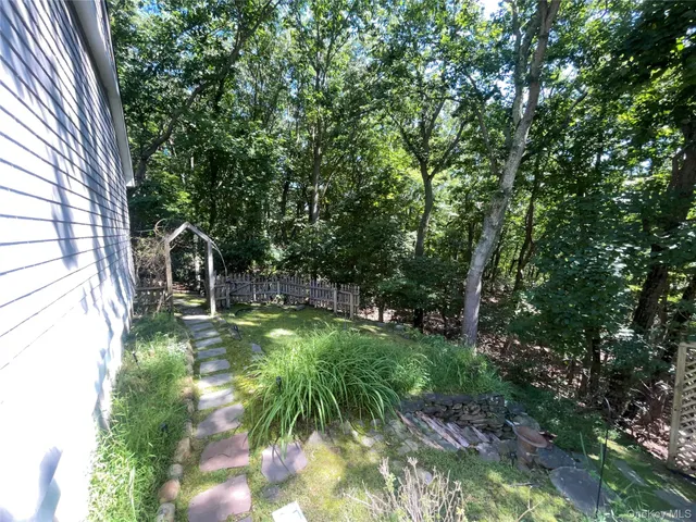 a backyard of a house with lots of green space