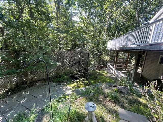 a view of a patio with table and chairs and potted plants