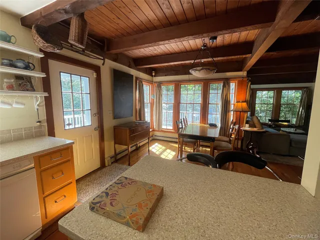 a living room with furniture large windows