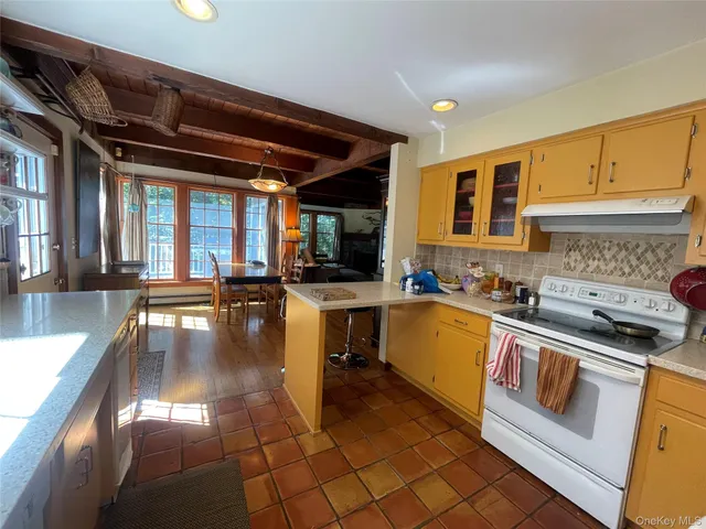 a kitchen with lots of counter top space and stainless steel appliances