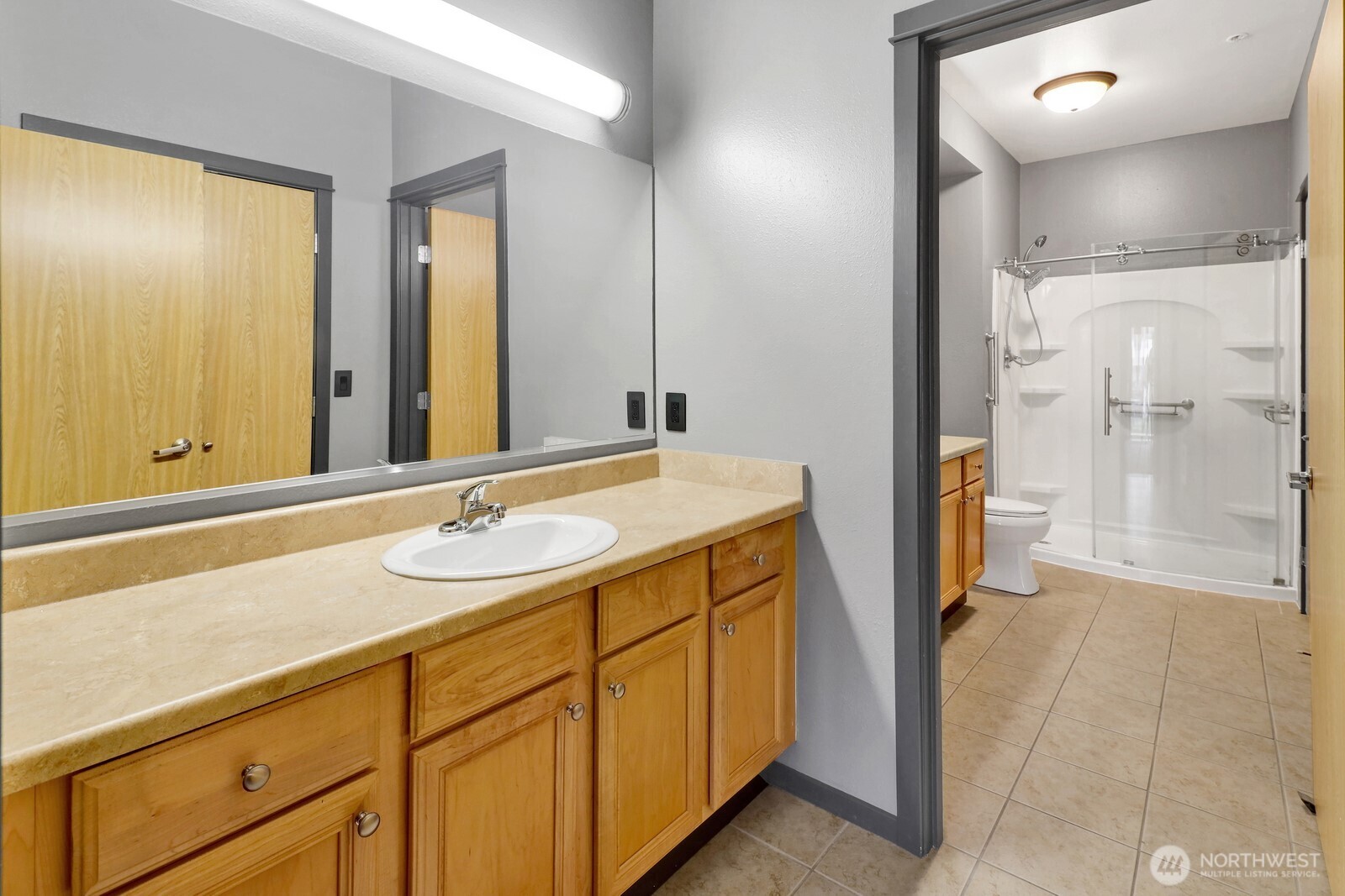 516 Darby Drive, Unit 104 Bellingham, WA 98226 - Photo 14 of 40 a bathroom with a sink and a mirror