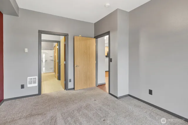 a view of an empty room and glass door