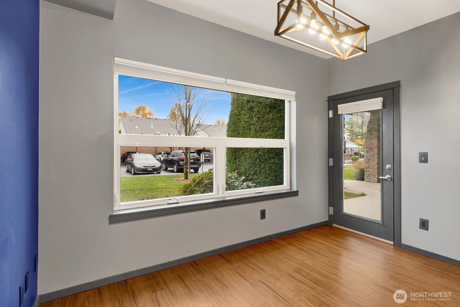 516 Darby Drive, Unit 104 Bellingham, WA 98226 - Photo 21 of 40 a view of an empty room with a window and wooden floor