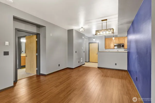 a view of a kitchen cabinets and wooden floor