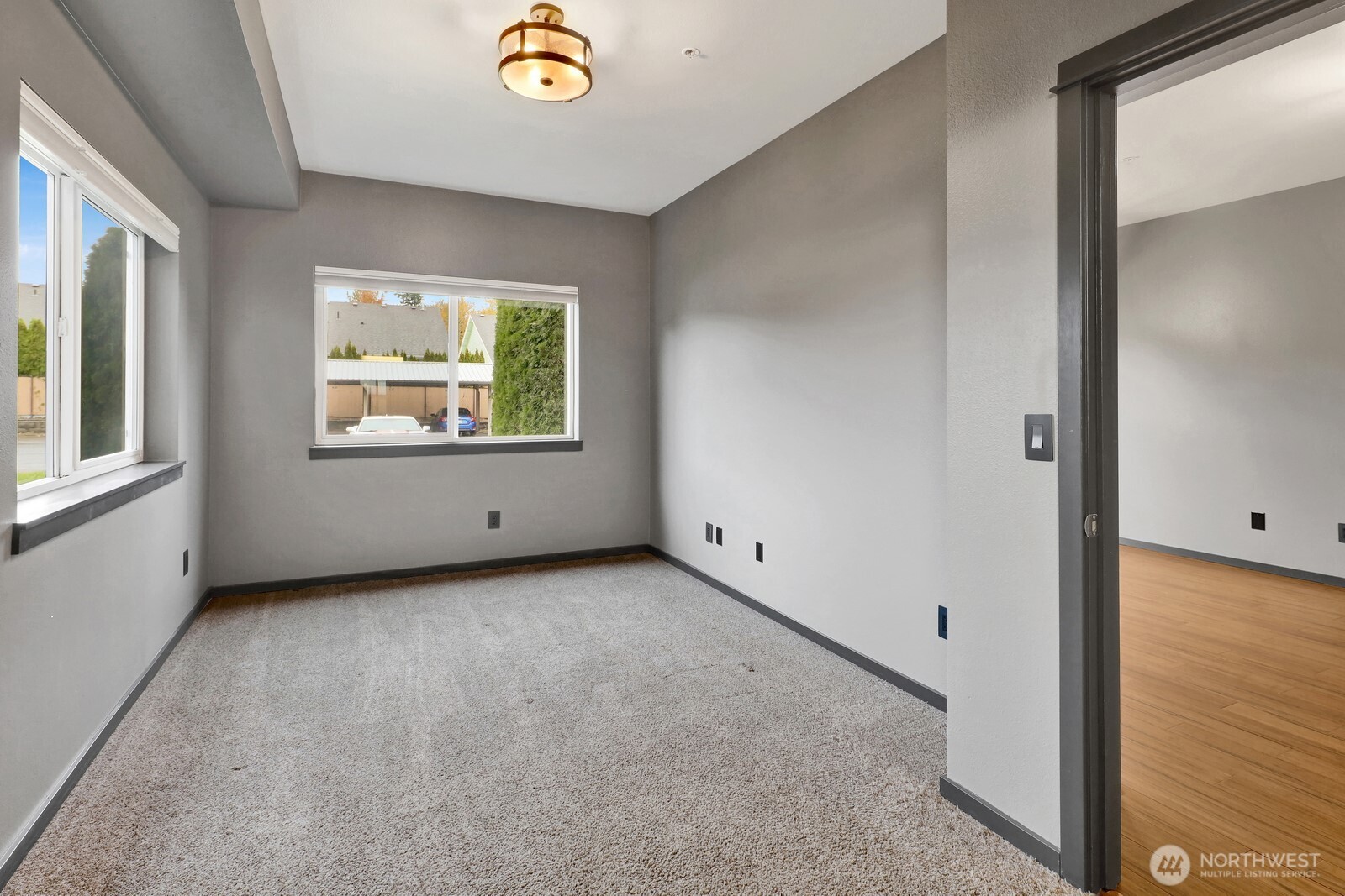 516 Darby Drive, Unit 104 Bellingham, WA 98226 - Photo 24 of 40 an empty room with windows and mirror