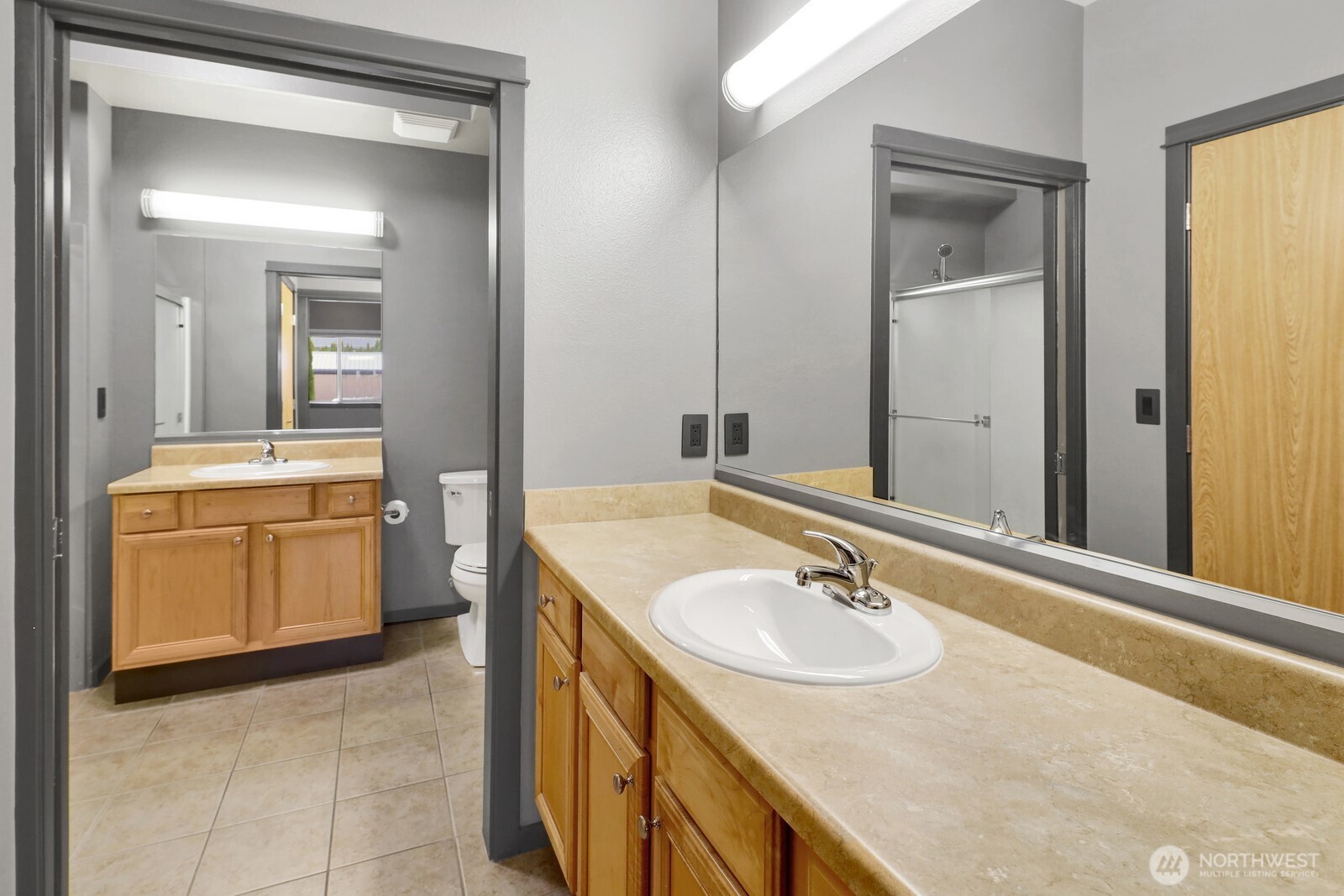 516 Darby Drive, Unit 104 Bellingham, WA 98226 - Photo 29 of 40 a bathroom with a sink and a mirror