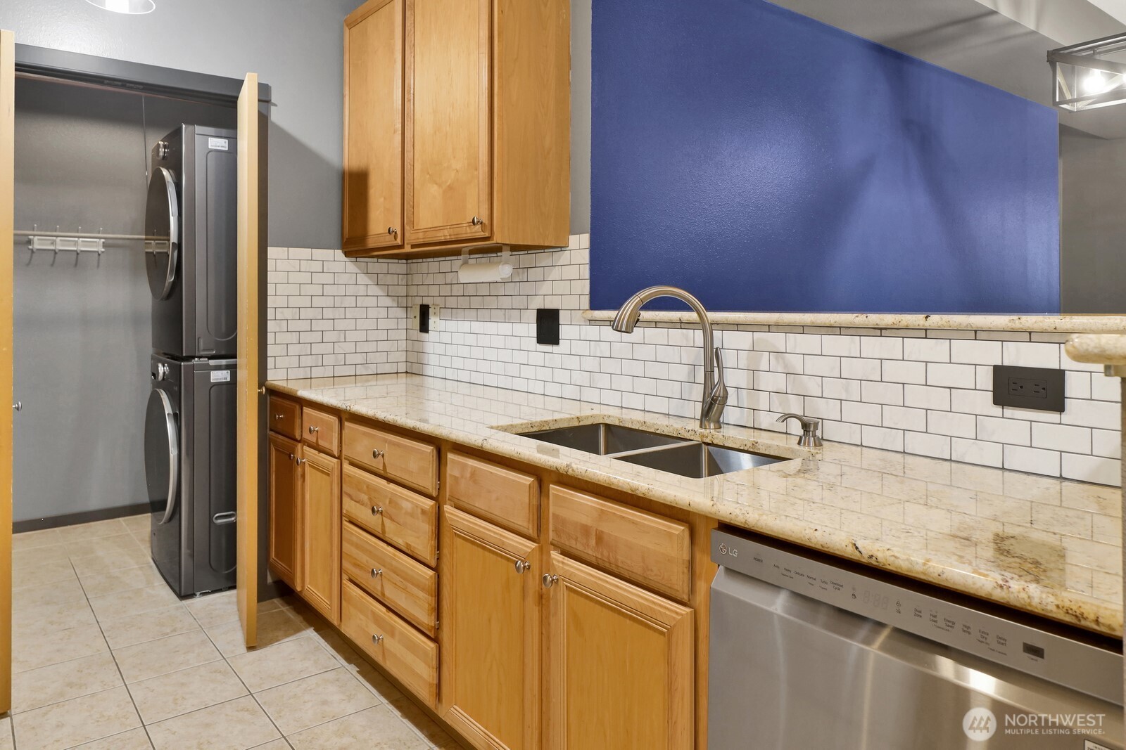 516 Darby Drive, Unit 104 Bellingham, WA 98226 - Photo 7 of 40 a kitchen with stainless steel appliances granite countertop a sink and cabinets