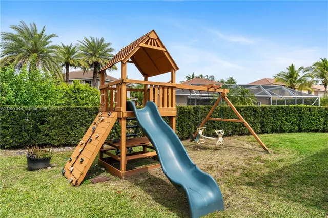 a view of a backyard with a slide