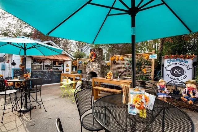 a view of a chairs and a table and chair in the balcony