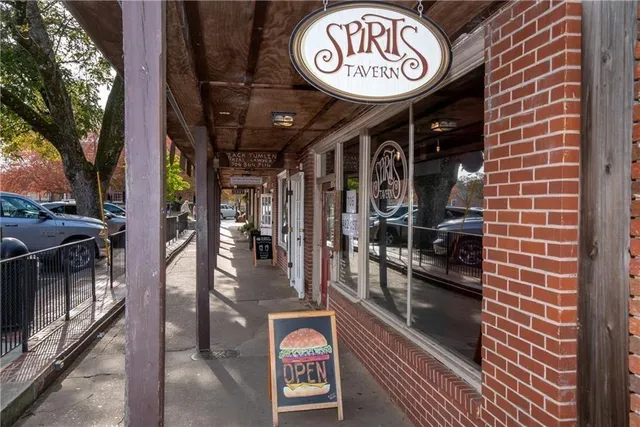 a swimming pool with outdoor seating and yard