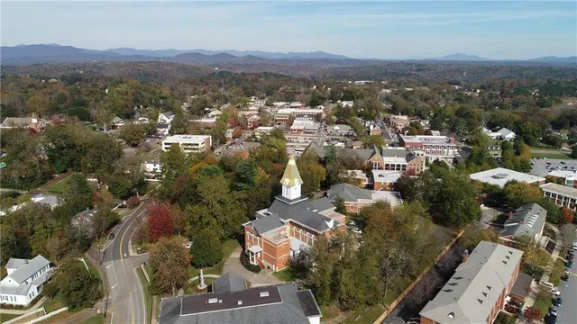an aerial view of a town with couple of houses