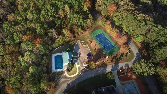 an aerial view of a house with garden space and sitting area