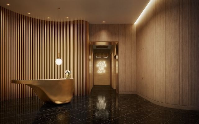 a kitchen with stainless steel appliances kitchen island granite countertop a refrigerator and wooden cabinets