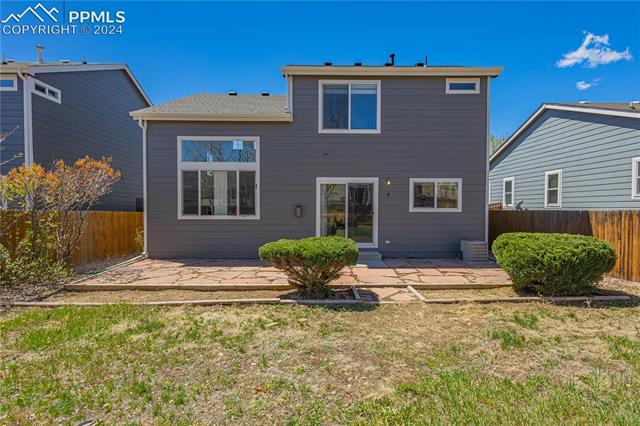 7523 Coffee Road Peyton, CO 80831 - Photo 16 of 18 Your large fully fenced backyard featuring flagstone patio ready for summer bbqs!