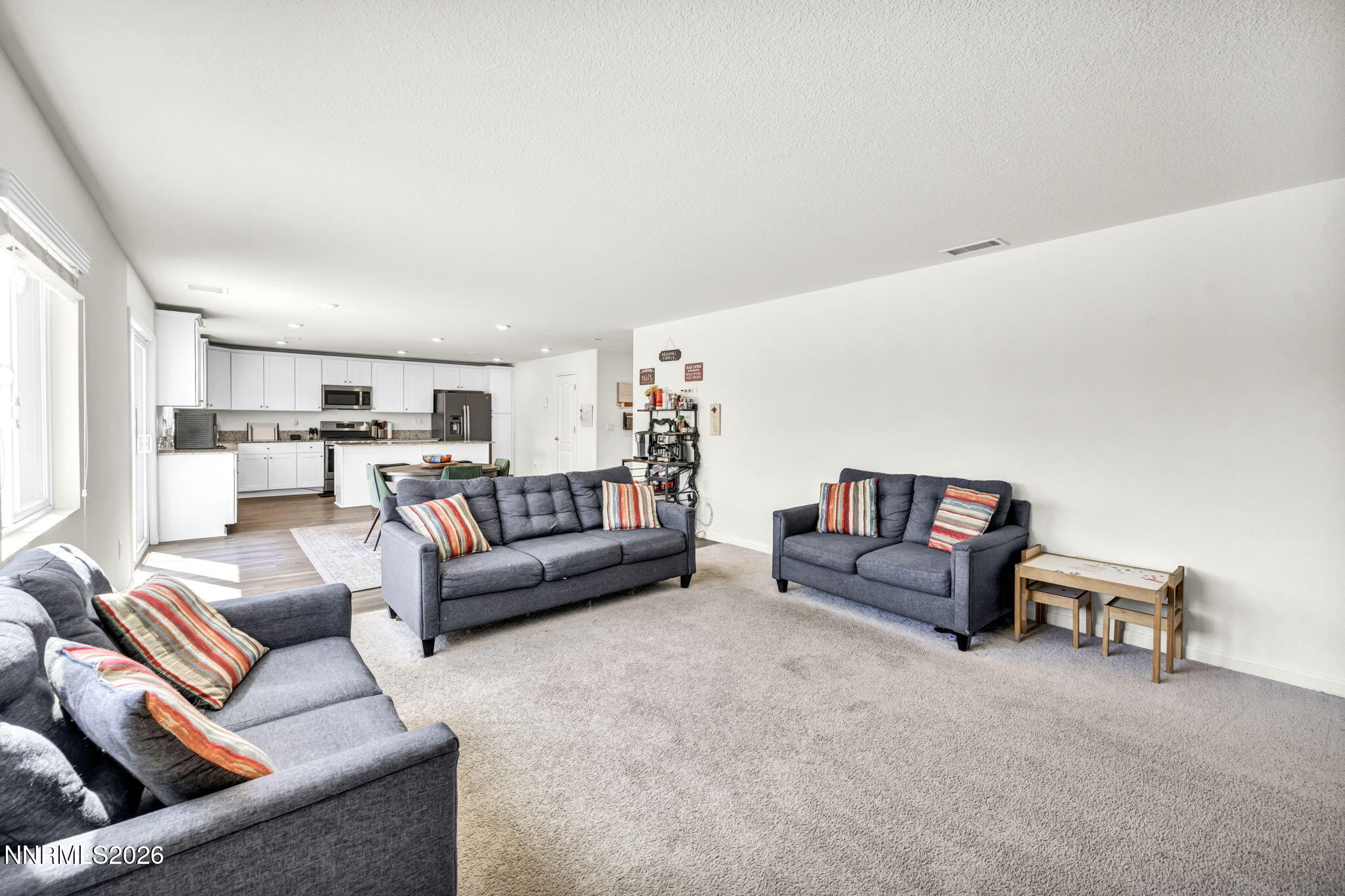 8982 Wolf River Drive Reno, NV 89506 - Photo 15 of 65 a living room with furniture and a large window
