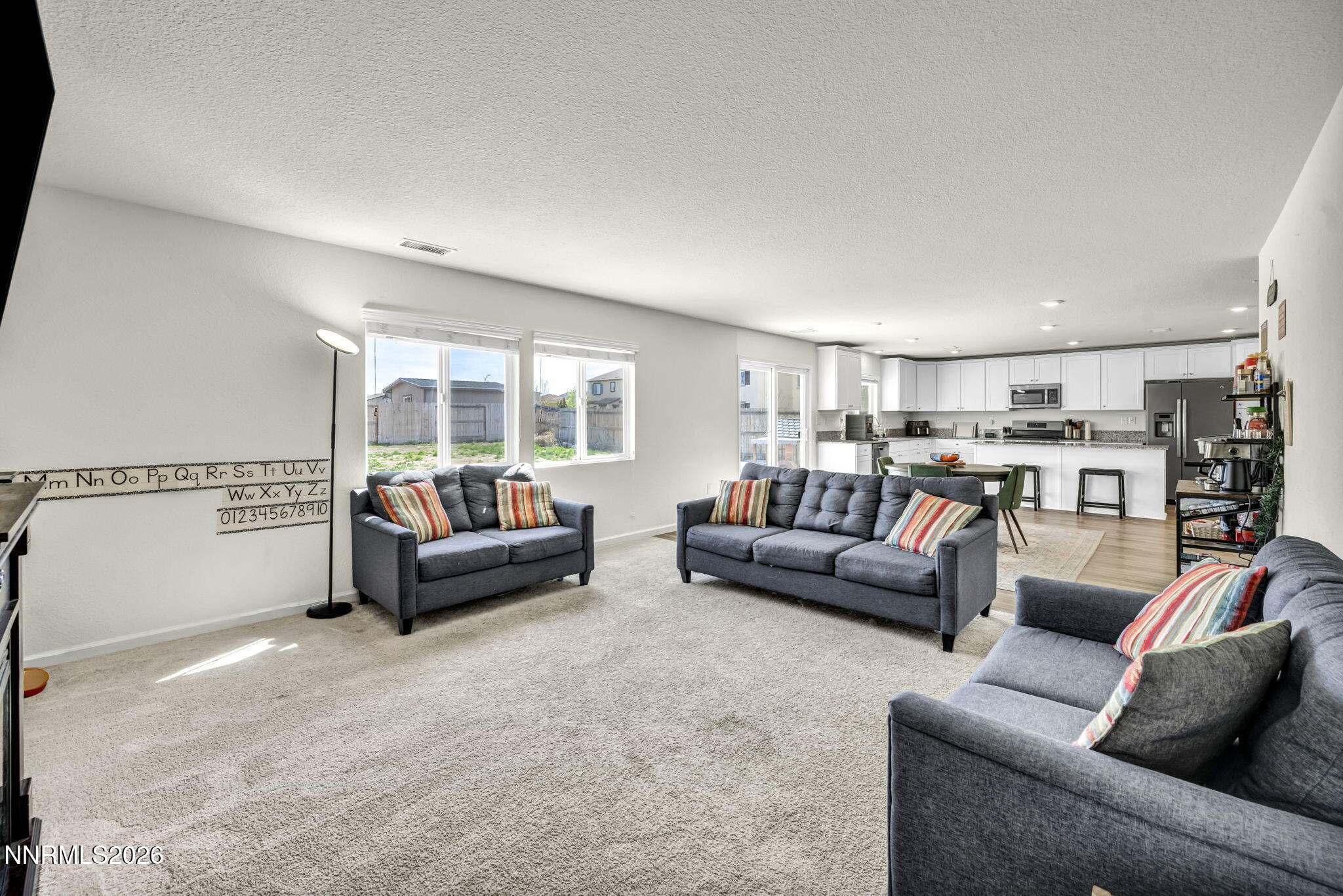 8982 Wolf River Drive Reno, NV 89506 - Photo 17 of 65 a living room with furniture and a large window