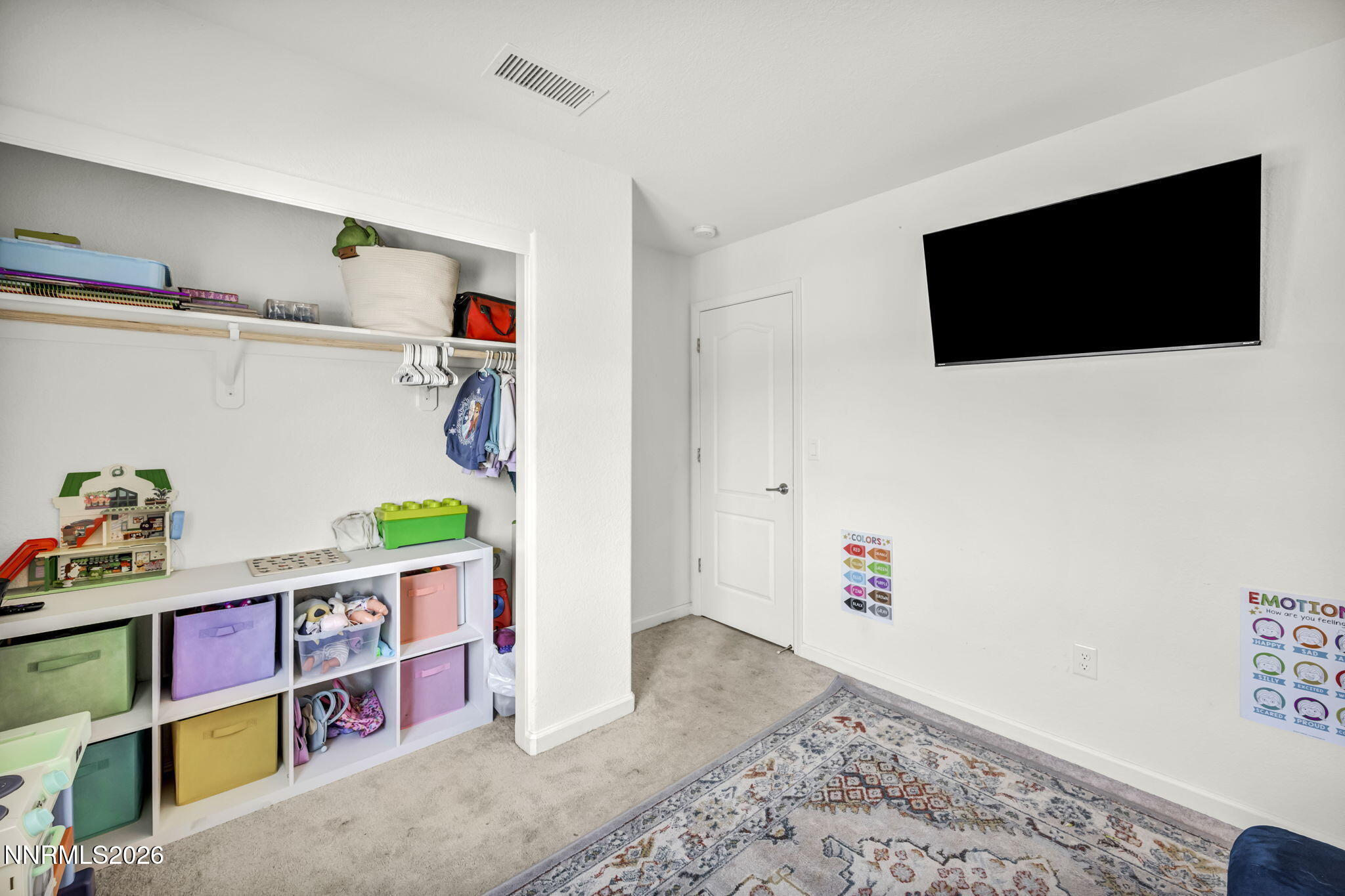 8982 Wolf River Drive Reno, NV 89506 - Photo 19 of 65 a room with toys and a flat screen tv