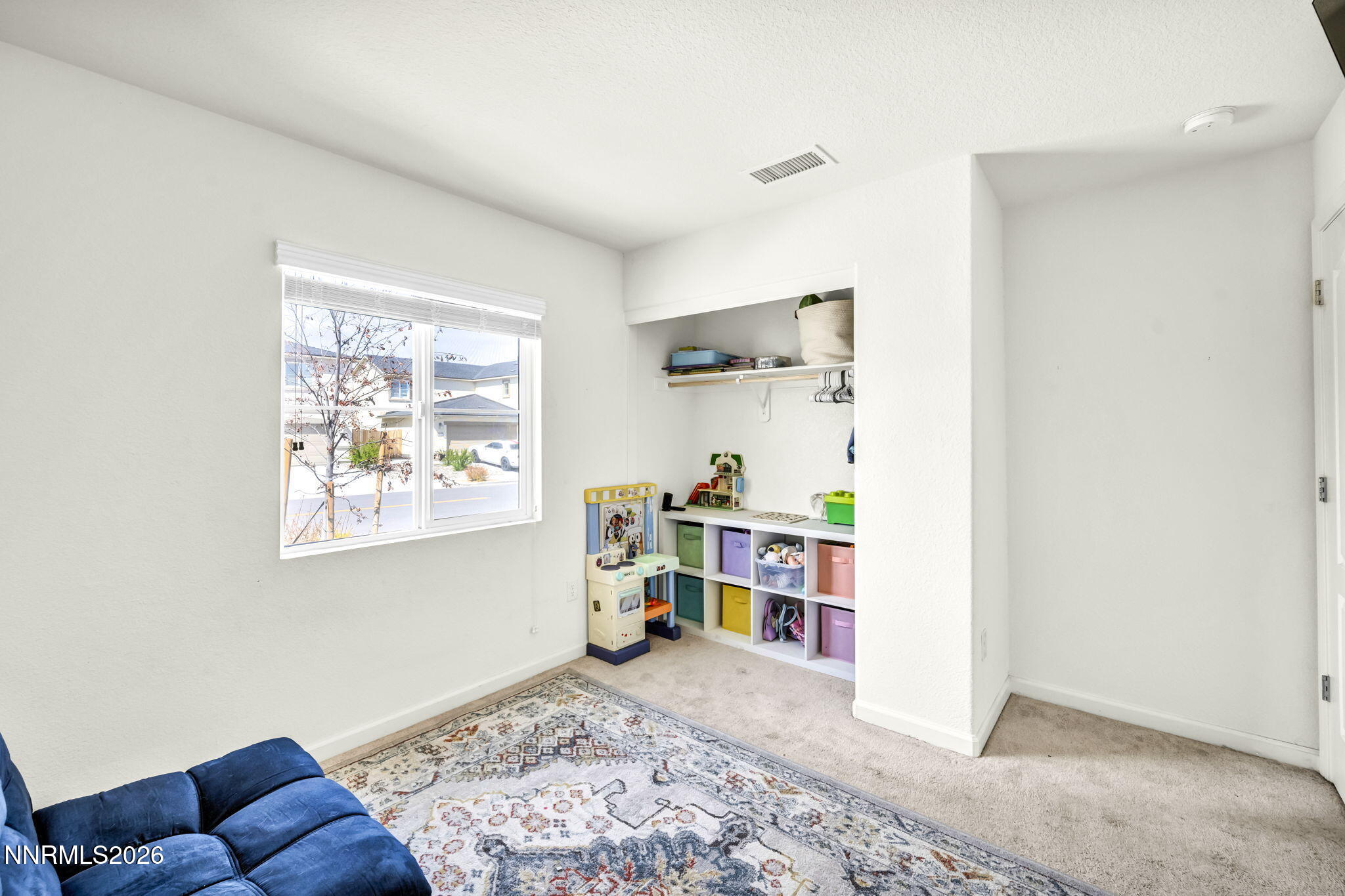 8982 Wolf River Drive Reno, NV 89506 - Photo 22 of 65 a view of a livingroom with workspace and a window