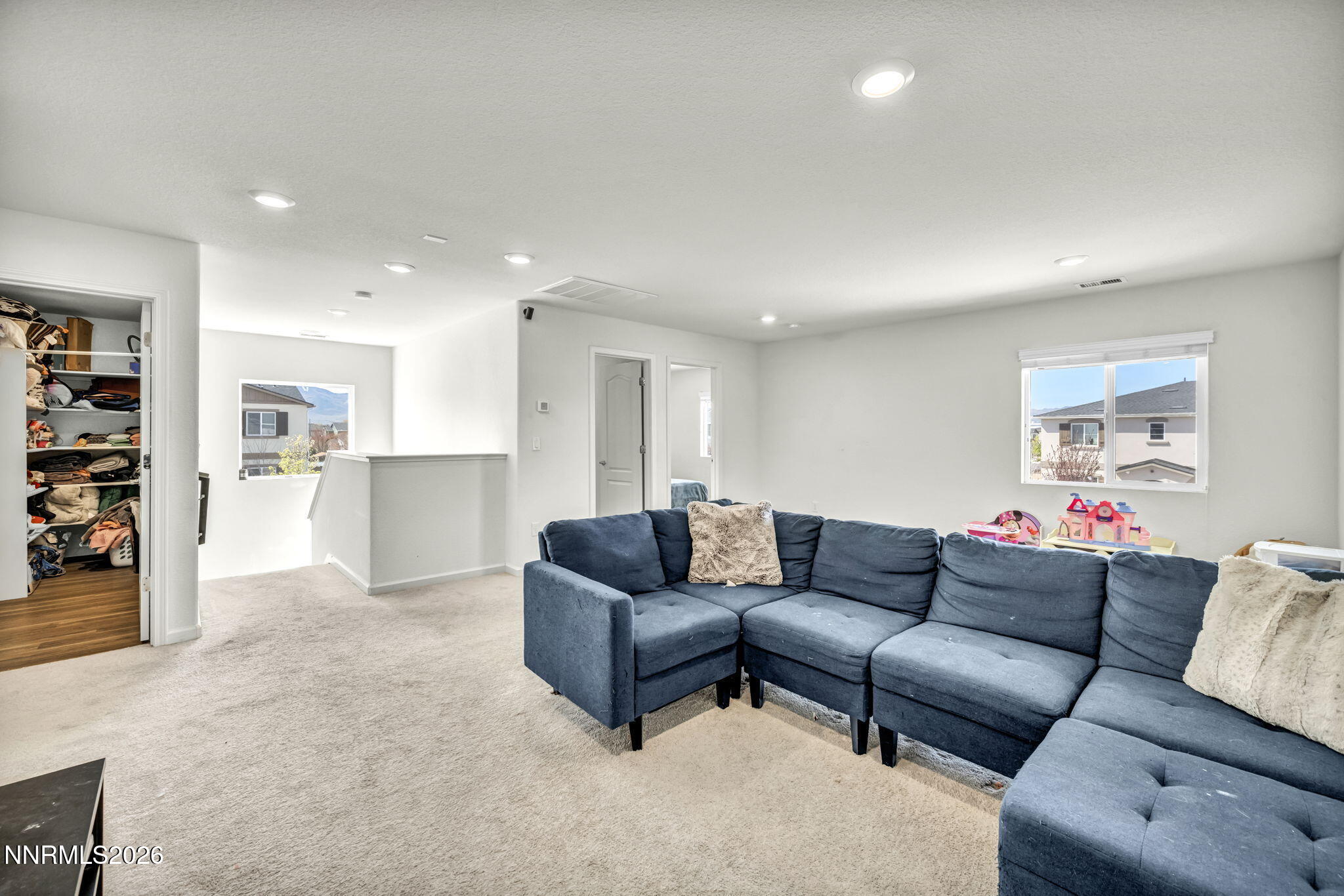 8982 Wolf River Drive Reno, NV 89506 - Photo 27 of 65 a living room with furniture and kitchen view