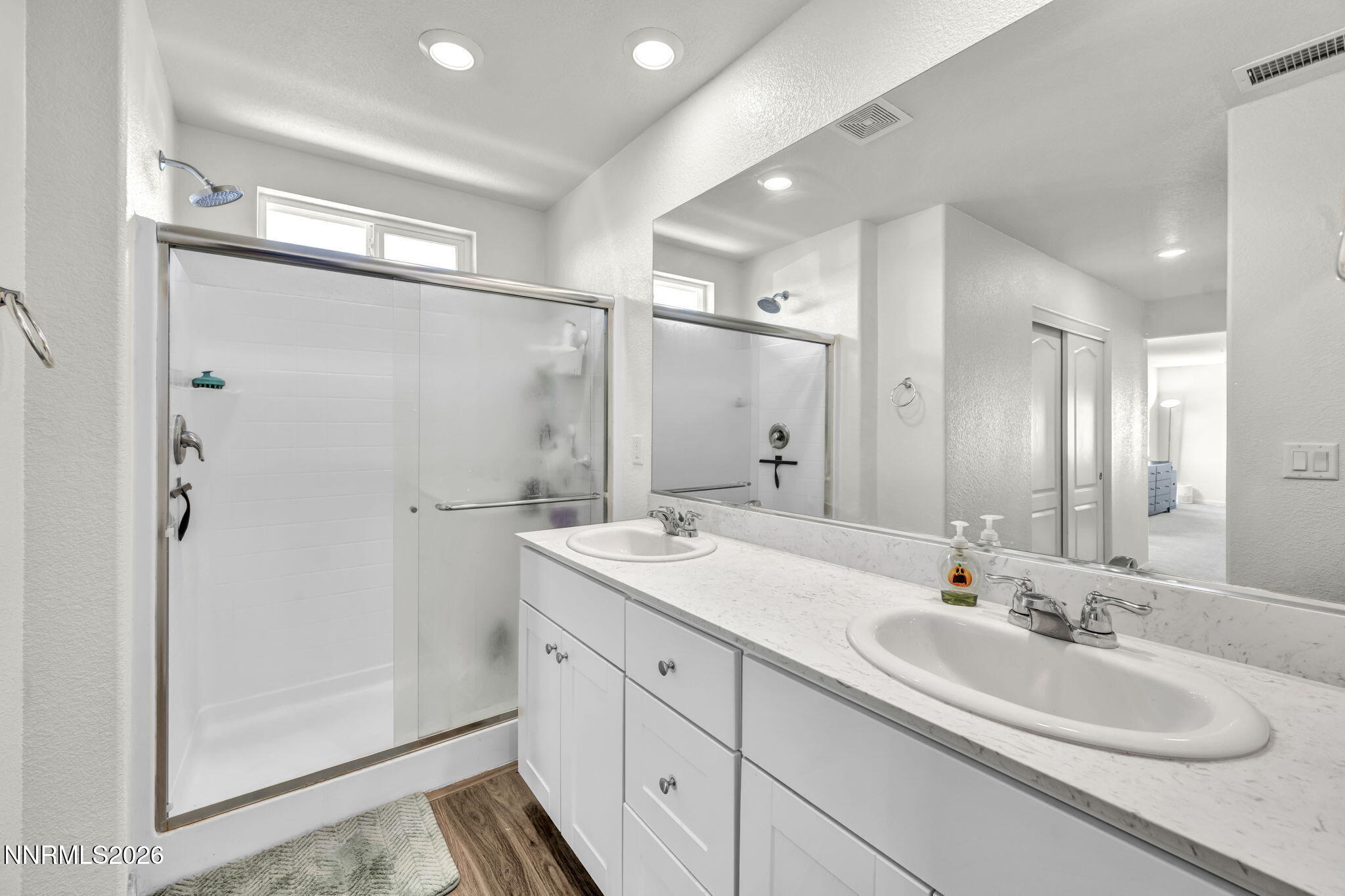 8982 Wolf River Drive Reno, NV 89506 - Photo 42 of 65 a bathroom with a double vanity sink mirror and double
