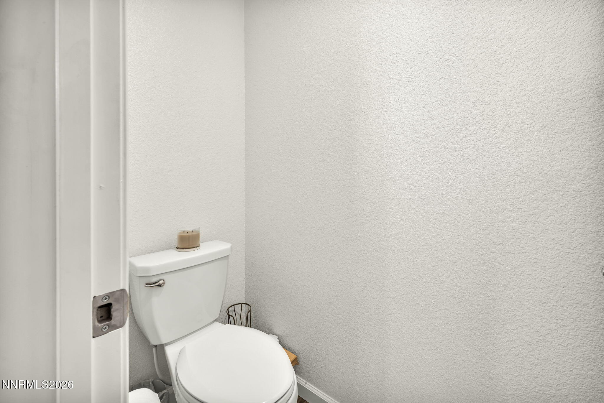 8982 Wolf River Drive Reno, NV 89506 - Photo 44 of 65 a white toilet sitting next to a white sink