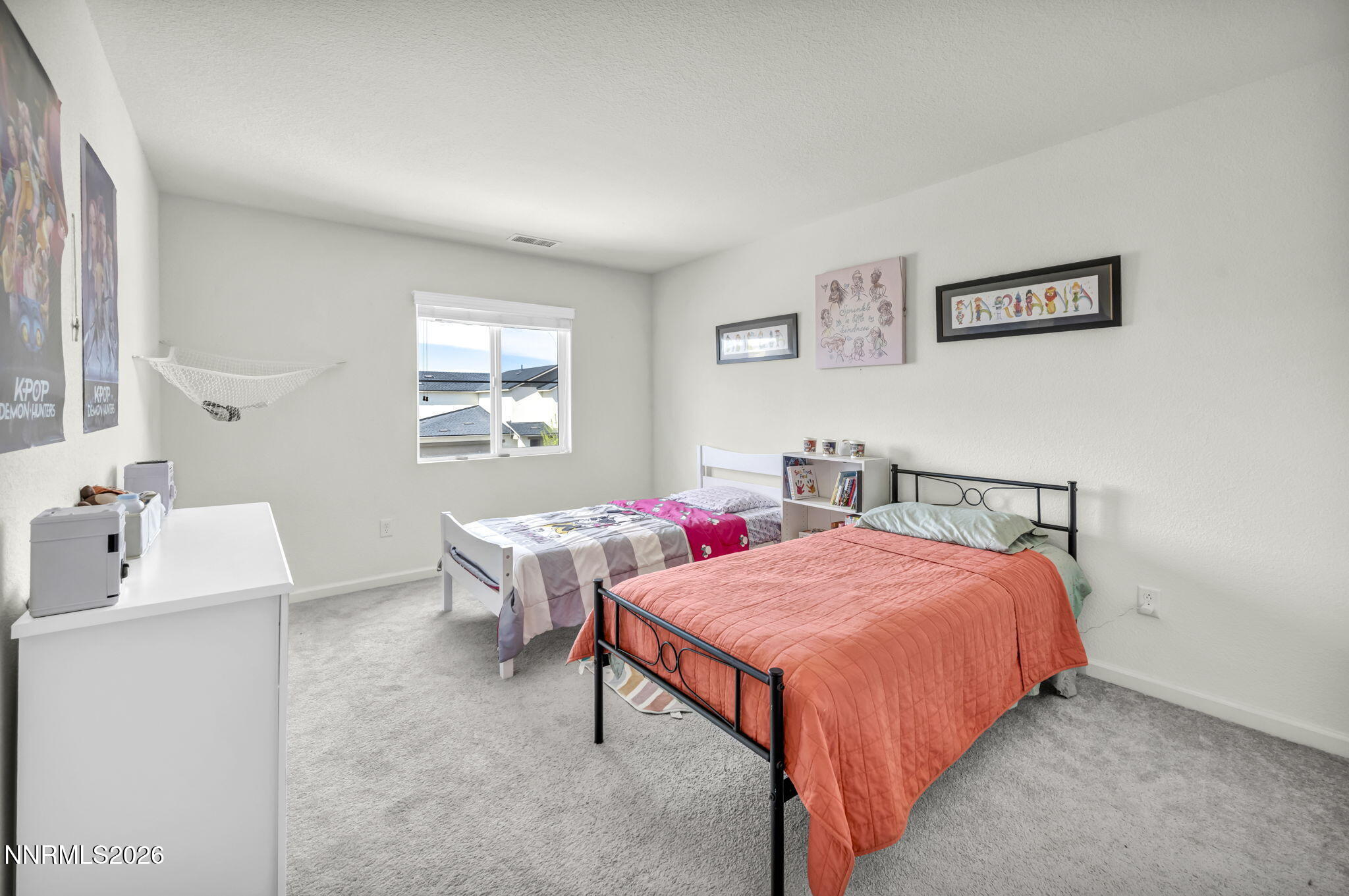 8982 Wolf River Drive Reno, NV 89506 - Photo 45 of 65 a bedroom with a bed and a table in it