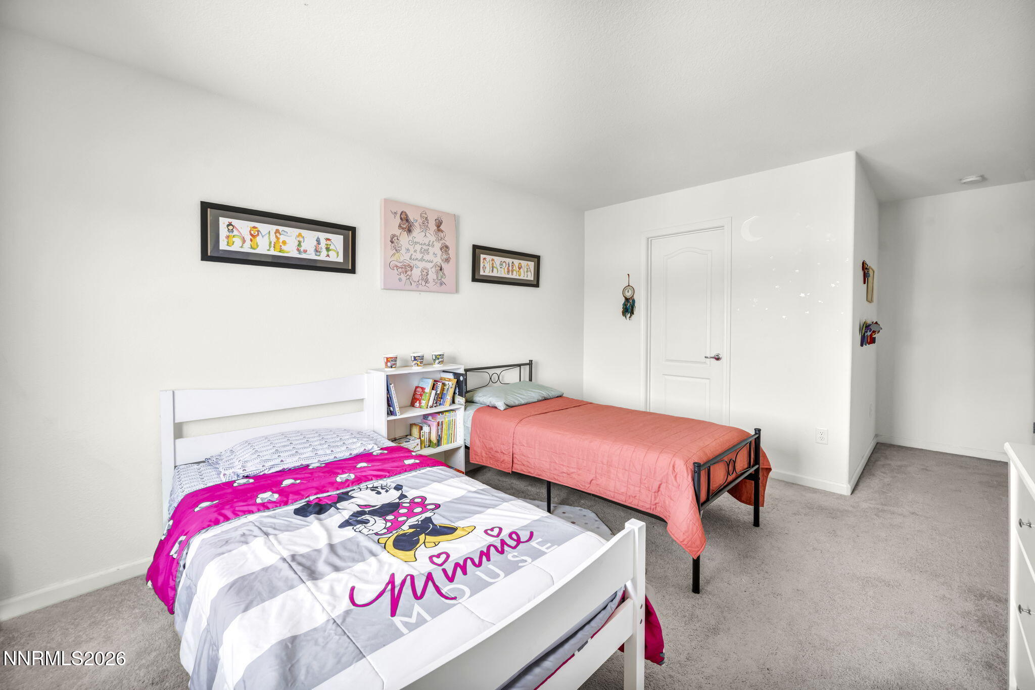 8982 Wolf River Drive Reno, NV 89506 - Photo 47 of 65 a bedroom with a bed and a lamp