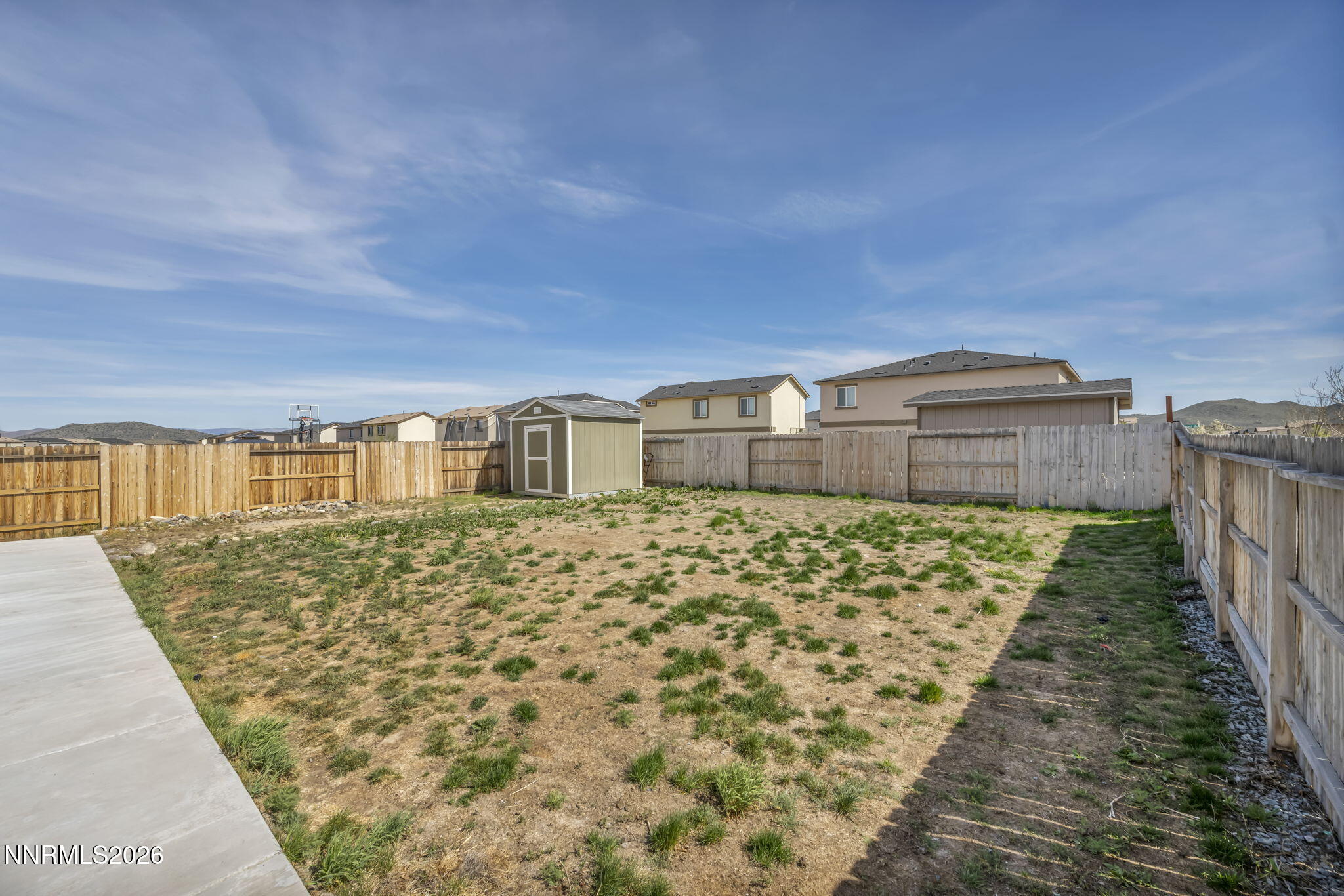 8982 Wolf River Drive Reno, NV 89506 - Photo 59 of 65 a front view of a house with a yard