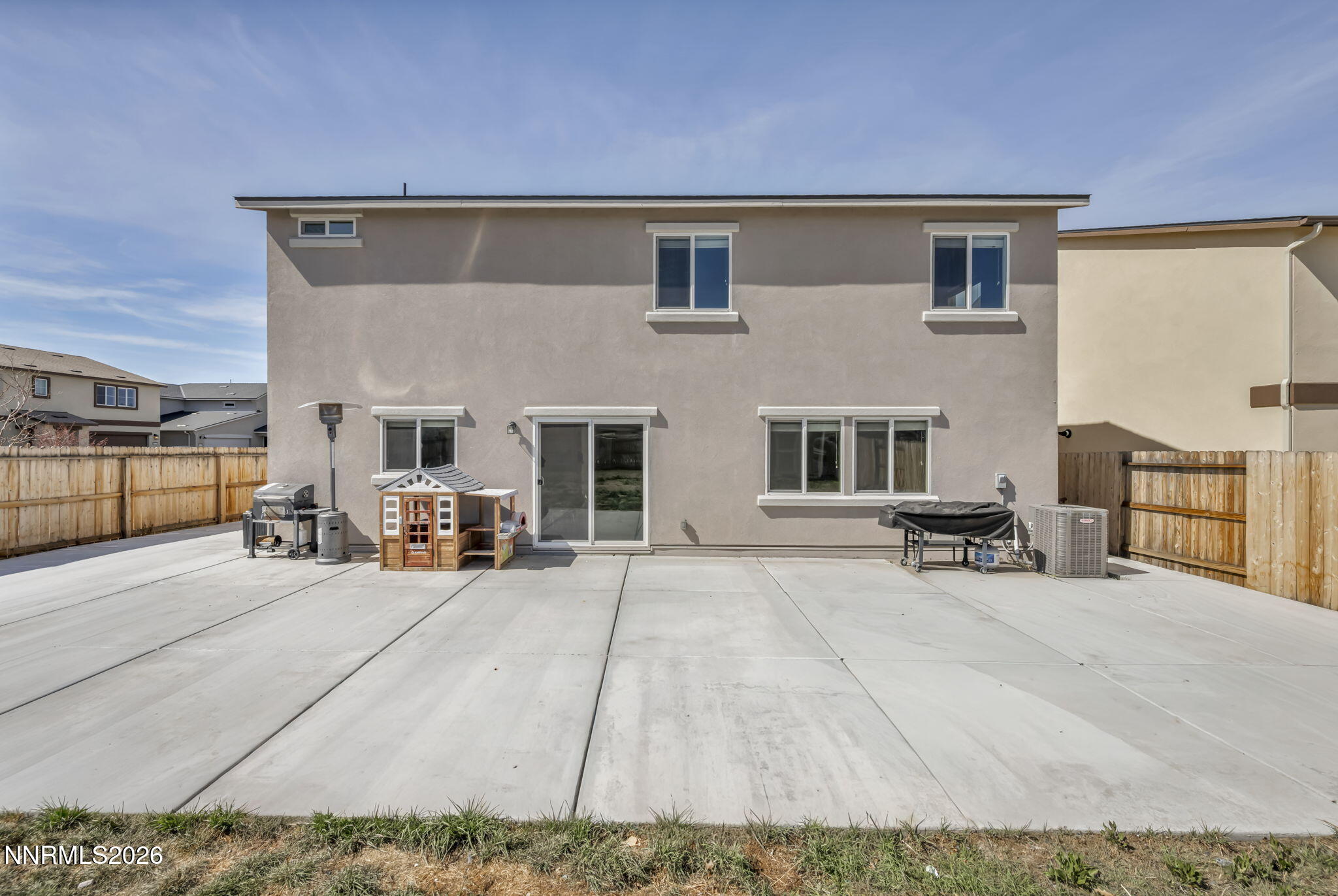 8982 Wolf River Drive Reno, NV 89506 - Photo 63 of 65 a view of a patio with table and chairs with wooden floor