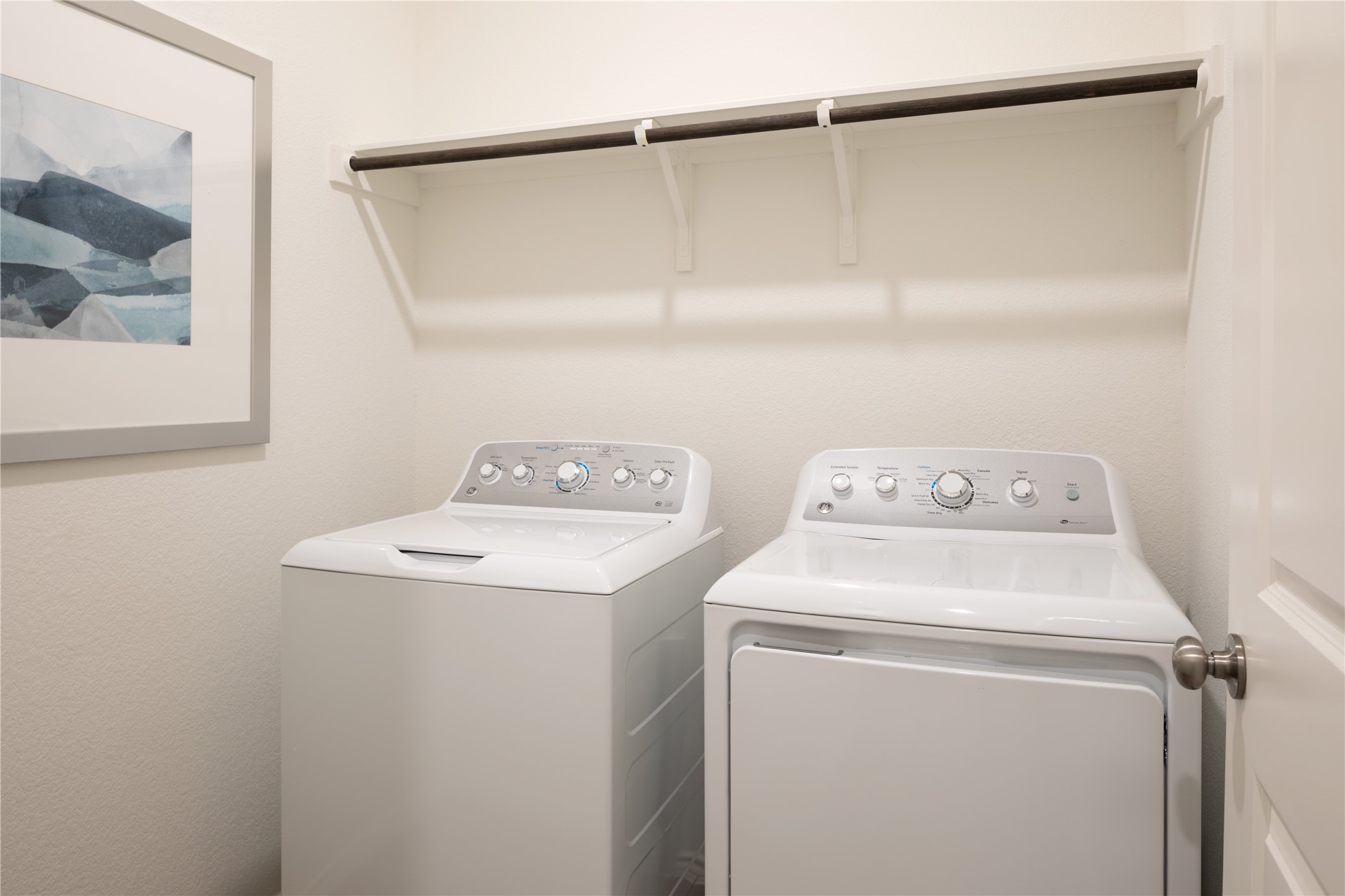 1306 Hermosa Gardens Georgetown, TX 78628 - Photo 15 of 16 a utility room with dryer and washer