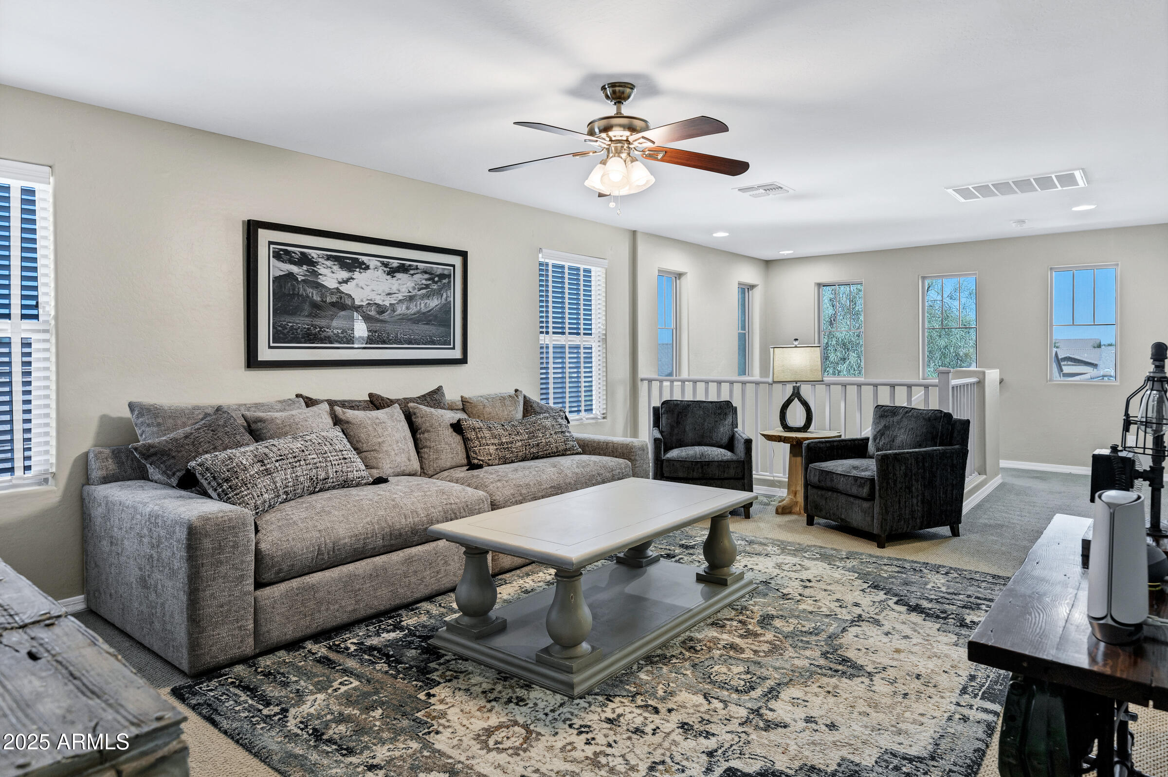 41311 West Elm Drive Maricopa, AZ 85138 - Photo 11 of 25 a living room with furniture and a chandelier