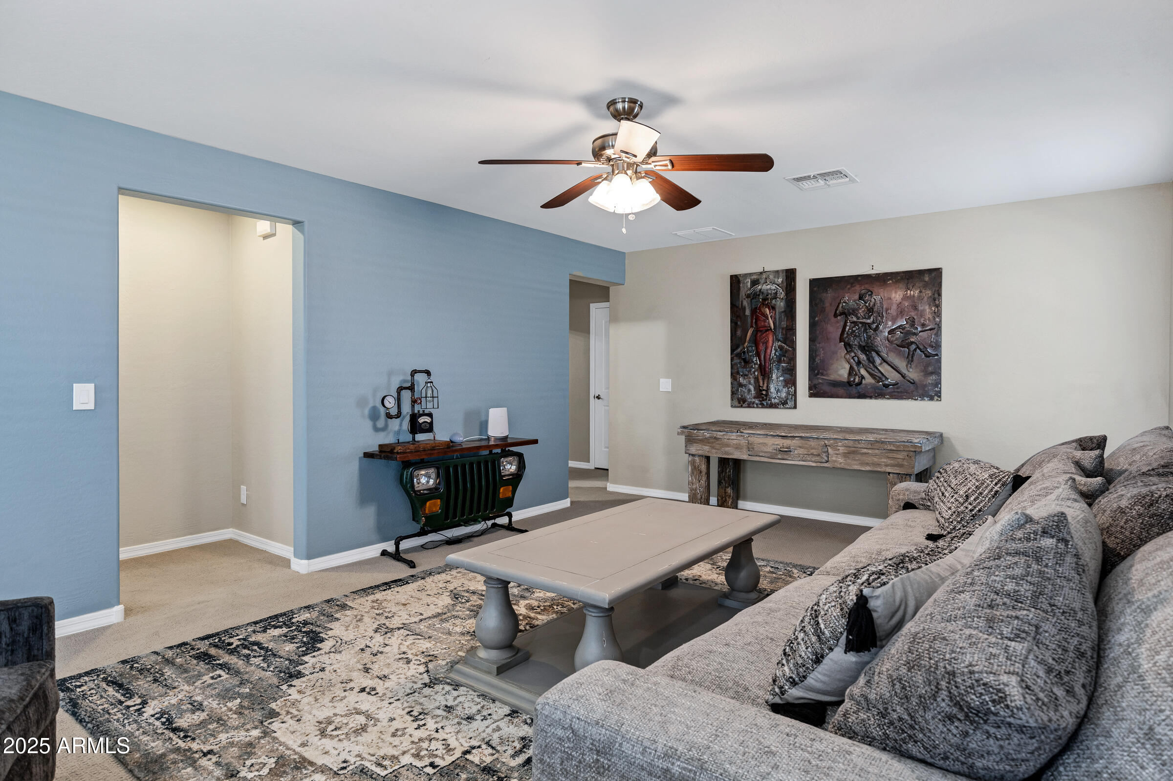 41311 West Elm Drive Maricopa, AZ 85138 - Photo 12 of 25 a living room with furniture and wooden floor
