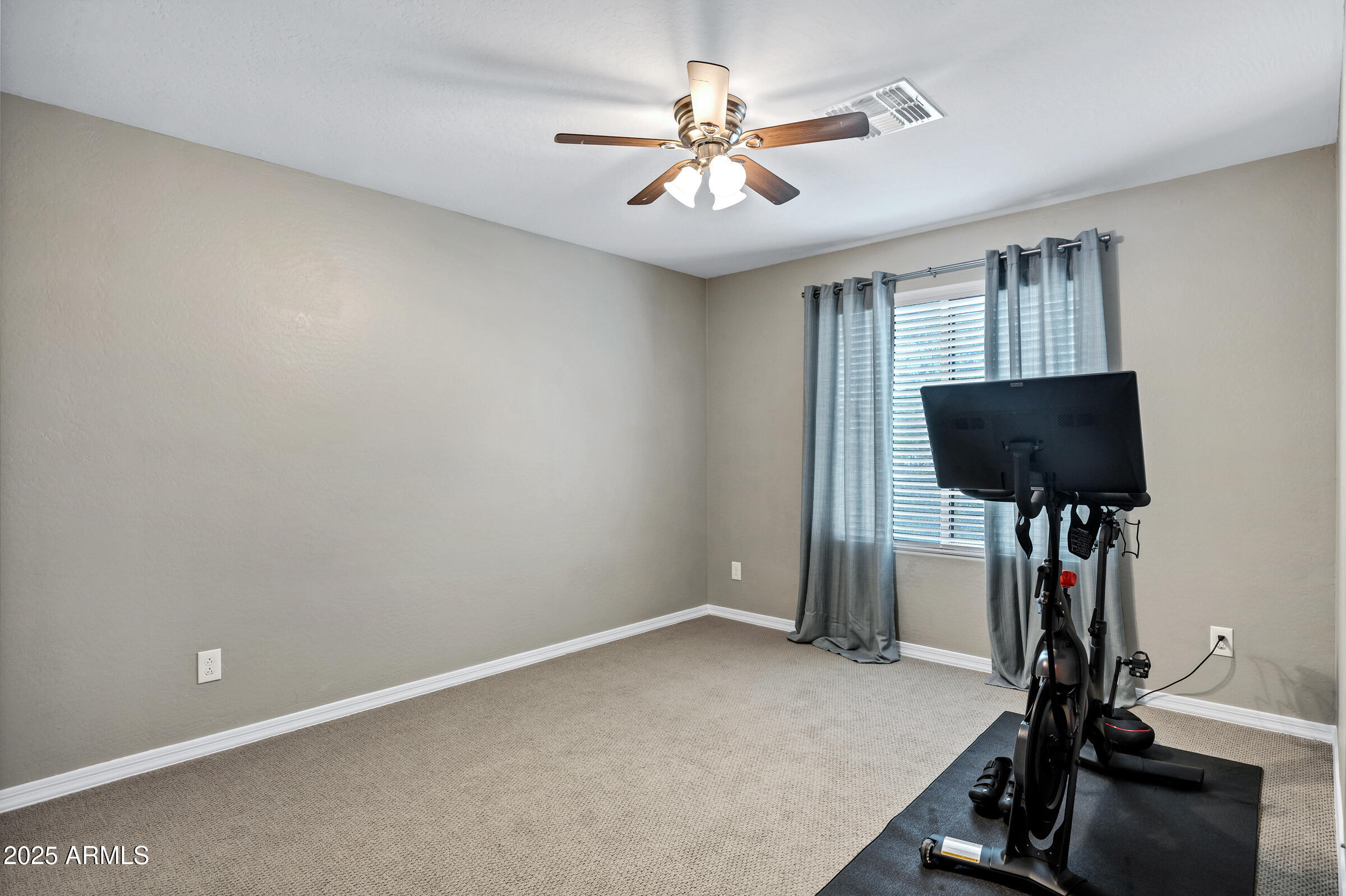 41311 West Elm Drive Maricopa, AZ 85138 - Photo 13 of 25 a view of a workspace with furniture and a window