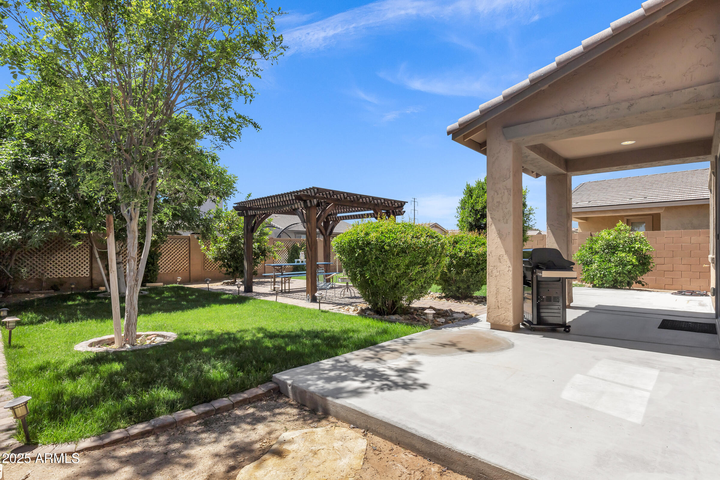 41311 West Elm Drive Maricopa, AZ 85138 - Photo 24 of 25 a front view of a house with garden