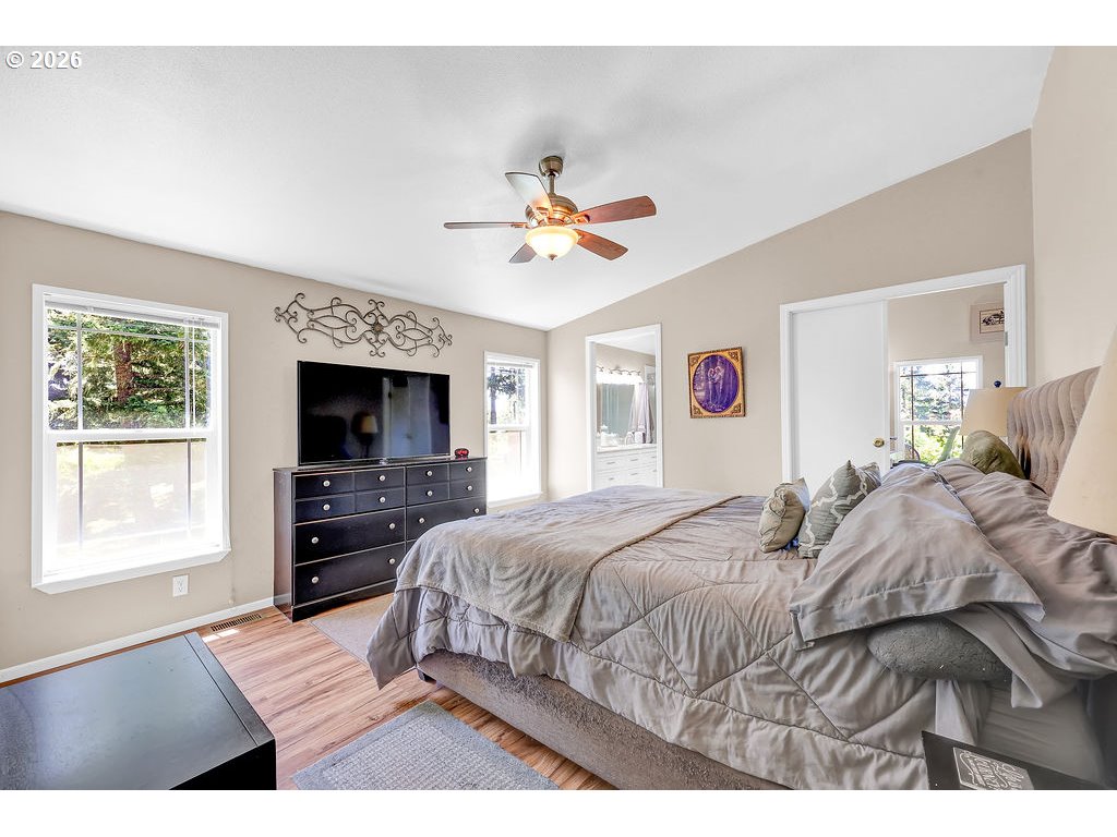 35235 Row River Road Cottage Grove, OR 97424 - Photo 11 of 28 a bedroom with a bed and a flat screen tv
