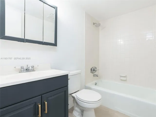 a bathroom with a sink a toilet and a bathtub