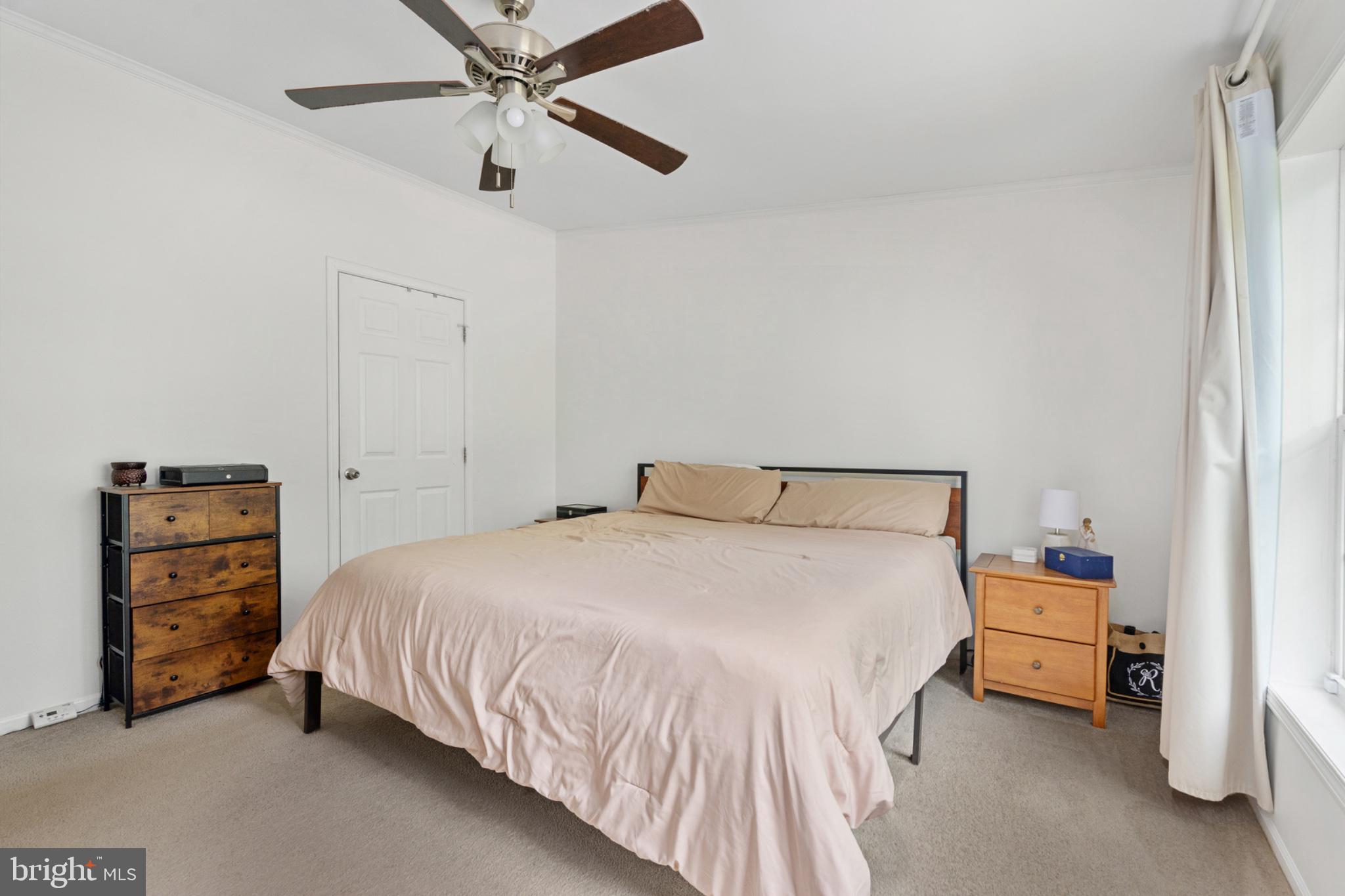 2319 Sizer Road Beaverdam, VA 23015 - Photo 42 of 61 a bedroom with a bed and a ceiling fan