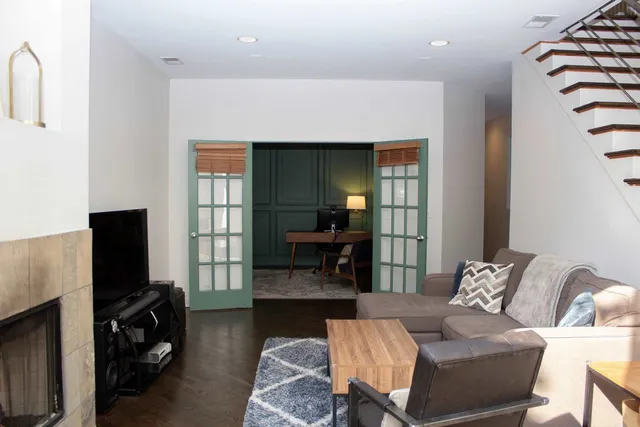 a work room with furniture and a window