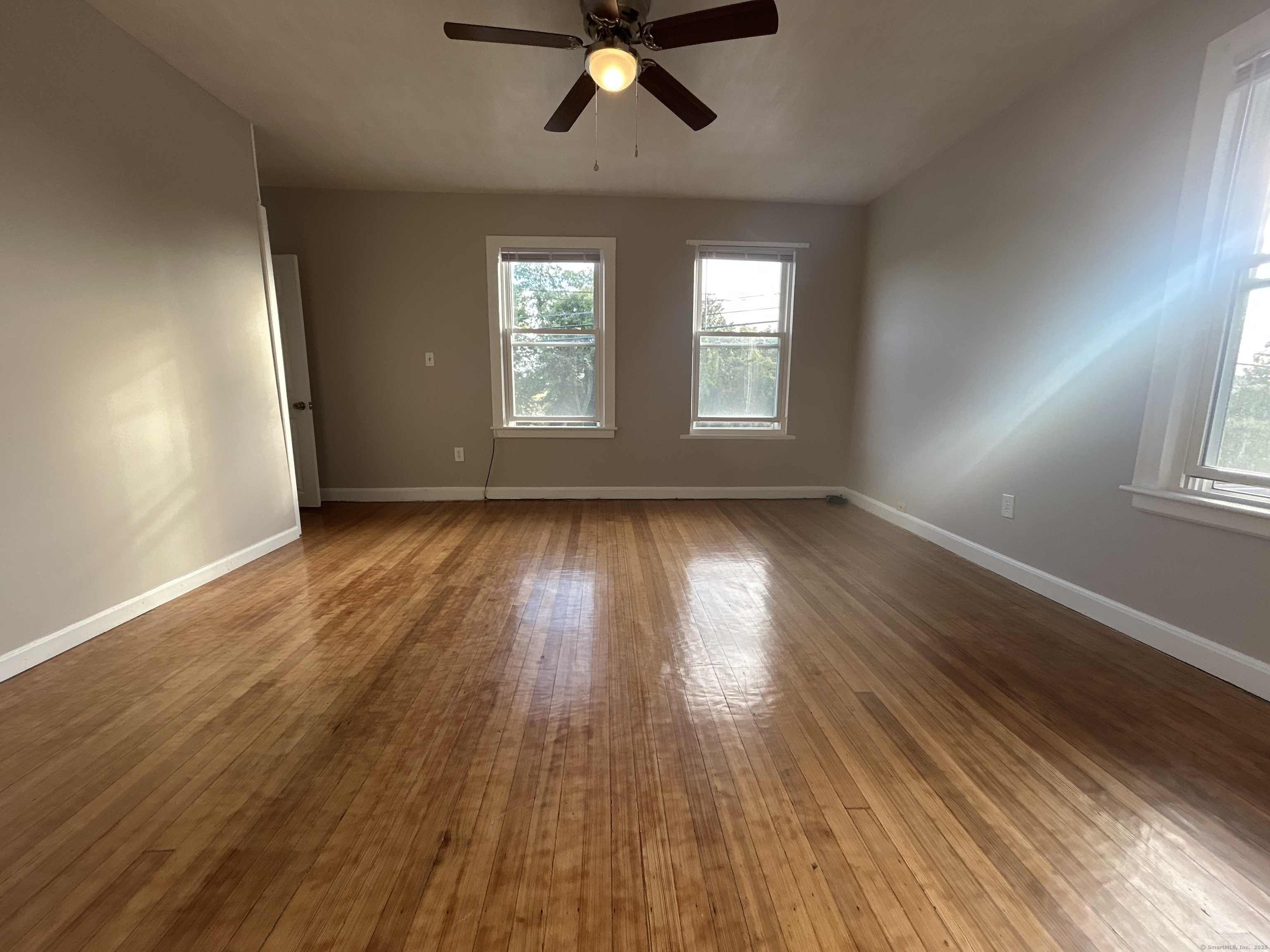 120 South End Road New Haven, CT 06512 - Photo 5 of 14 wooden floor in an empty room with a window