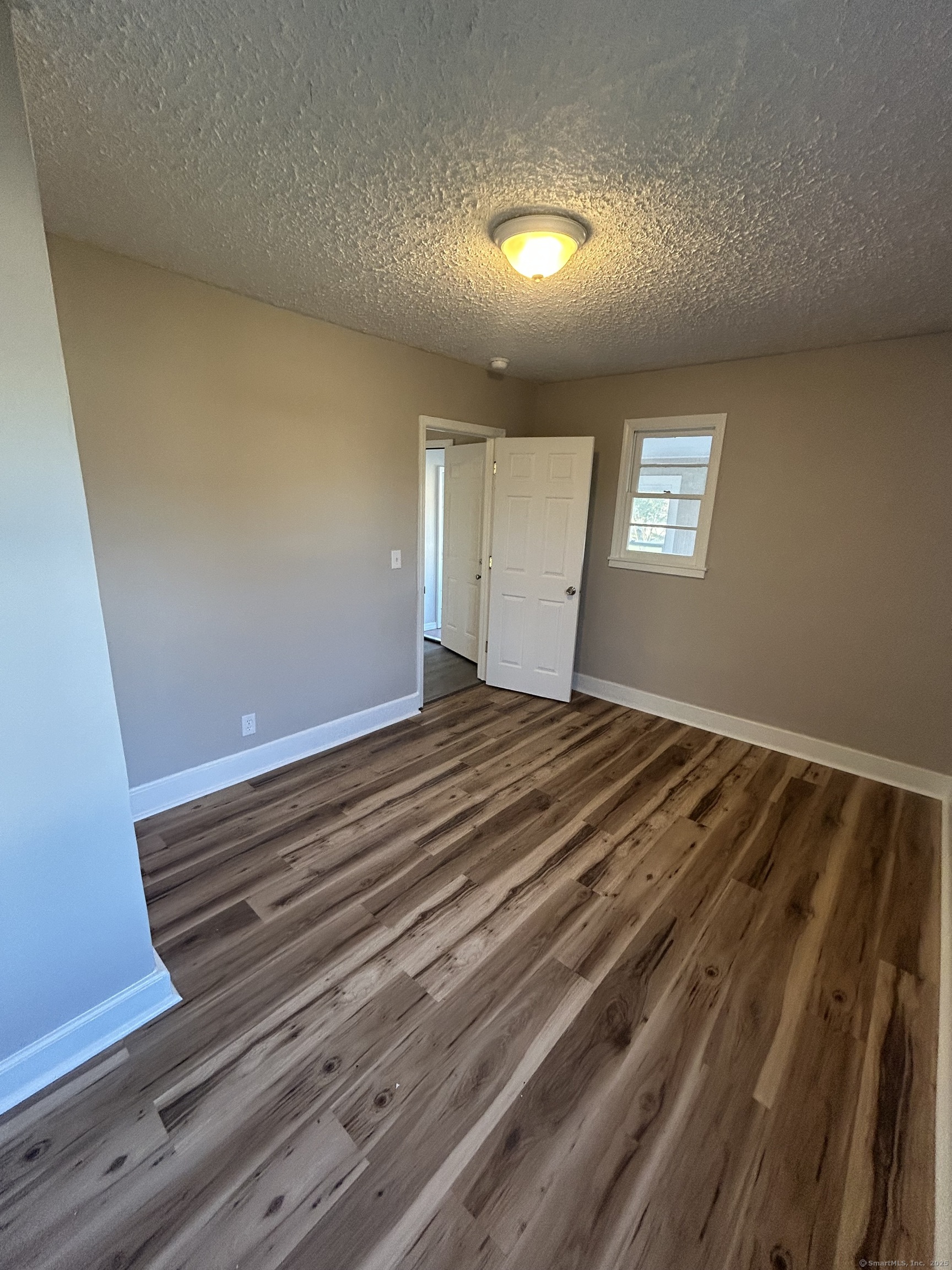 120 South End Road New Haven, CT 06512 - Photo 8 of 14 a view of a room with wooden floor and window