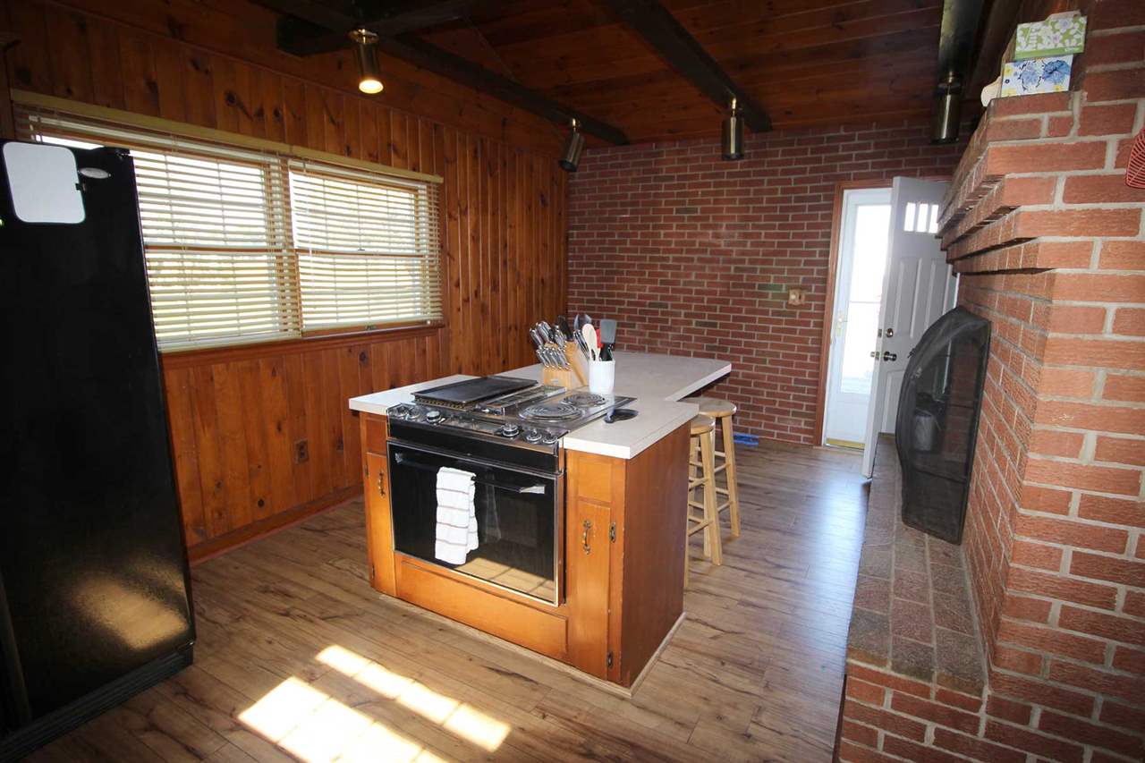 4622 Ottobine Road Dayton, VA 22821 - Photo 9 of 24 a kitchen with stainless steel appliances granite countertop a stove a sink and a microwave