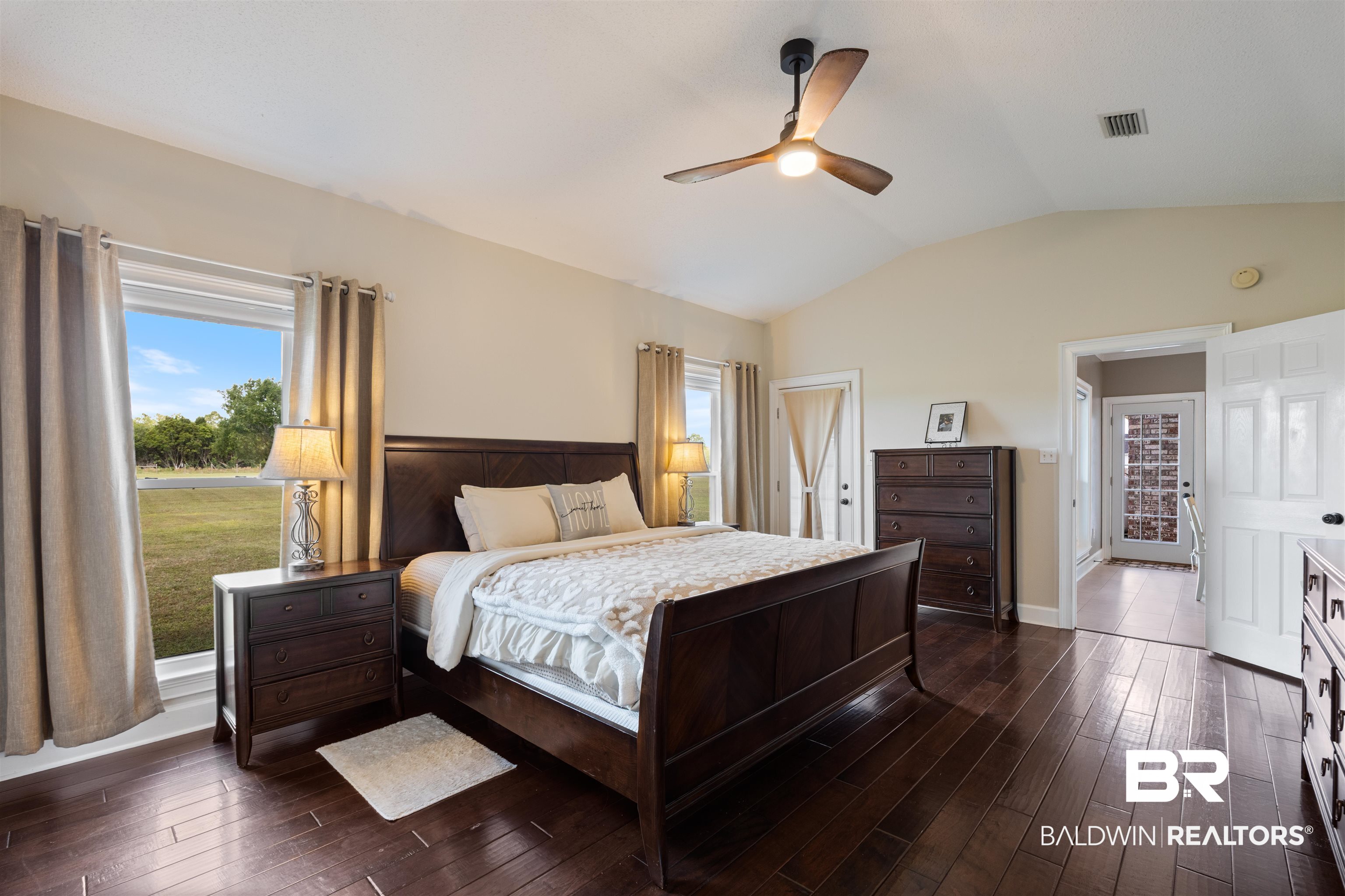 9855 Stucki Road Elberta, AL 36530 - Photo 30 of 54 Bedroom featuring dark wood finished floors, a closet, and ceiling fan