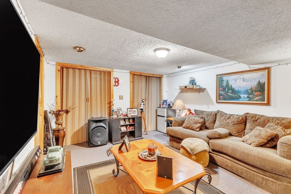 610 County Road, Unit 2 Holyoke, MA 01040 - Photo 31 of 42 a living room with furniture and a large window