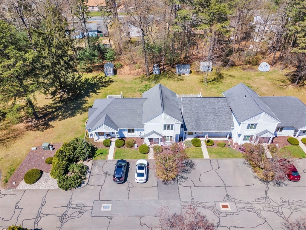 610 County Road, Unit 2 Holyoke, MA 01040 - Photo 41 of 42 an aerial view of a house with swimming pool and large trees