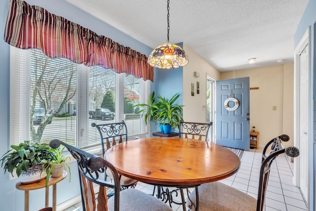 610 County Road, Unit 2 Holyoke, MA 01040 - Photo 5 of 42 a view of a dining room with furniture window and wooden floor